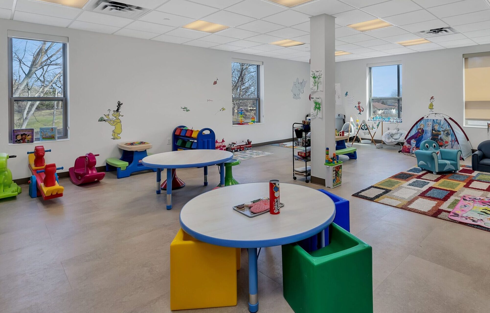Children's tables, chairs and toys in playroom