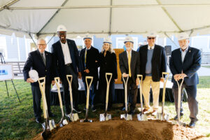 Speakers at Andy's Place II groundbreaking with shovels