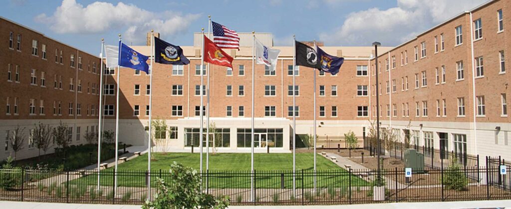 Apartment building exterior with military flags flying