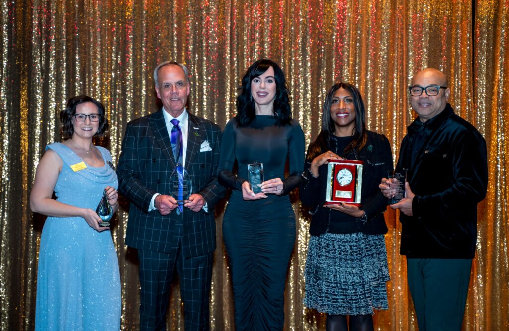 Mark McDaniel - 2nd to left - holds his Legacy Award with other 4 awardees on stage