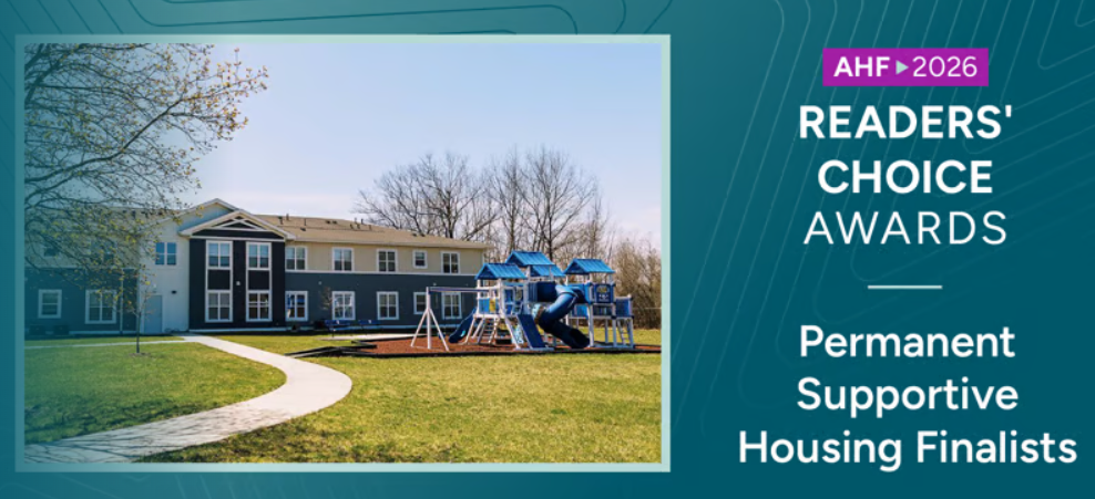 Photo of McDaniel Apts with playground and AHF award announcement